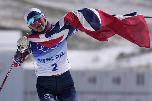 Norway's Therese Johaug reacts after crossing the finish during the women's 30km mass start free cross-country skiing competition at the 2022 Winter Olympics, Sunday, Feb. 20, 2022, in Zhangjiakou, China. (AP Photo/Alessandra Tarantino)