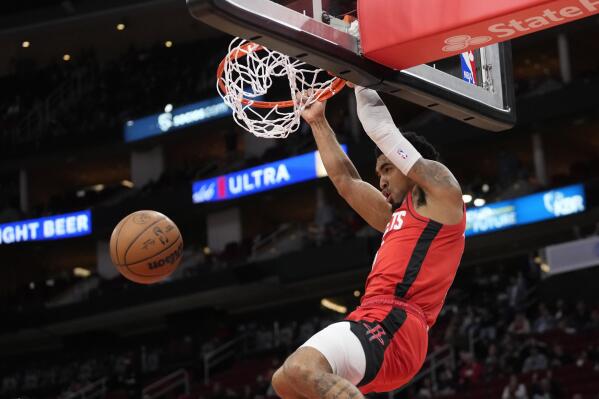 Houston Rockets' Kenyon Martin Jr. dunks the ball against the Washington Wizards during the first half of an NBA basketball game Wednesday, Jan. 25, 2023, in Houston. (AP Photo/David J. Phillip)