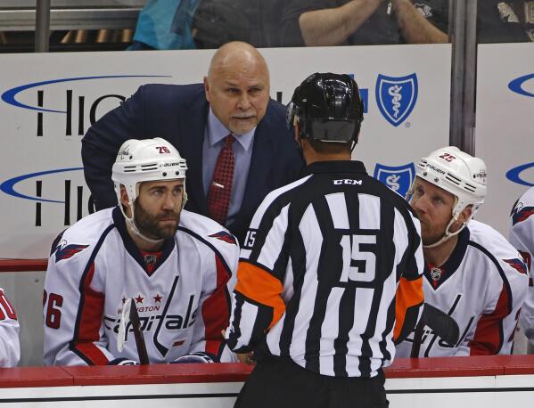 FILE - In this May 4, 2016, file photo, Washington Capitals head coach Barry Trotz talks to referee Jean Hebert, (15), during the first period of Game 4 against the Pittsburgh Penguins in an NHL hockey Stanley Cup Eastern Conference semifinals in Pittsburgh. NHL coaches will have more technology on the bench than ever before as the Stanley Cup playoffs begin. Three iPad Pros will be available for coaches on every bench and officials will also have them to review coach’s challenges, The Associated Press has learned. (AP Photo/Gene J. Puskar, File)