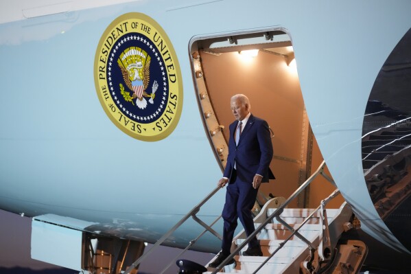 President Joe Biden walks down the stairs of Air Force One as he arrives in Los Angeles, Calif., Friday, Dec. 8, 2023. (AP Photo/Manuel Balce Ceneta)