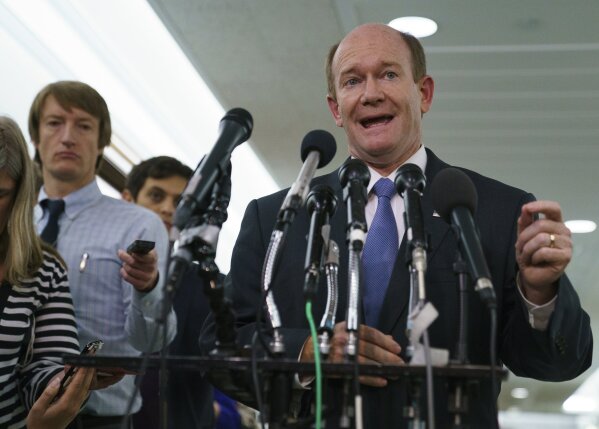 
              Senate Judiciary Committee member Sen. Chris Coons, D-Del., talks to media after a Senate Judiciary Committee hearing on Capitol Hill in Washington, Friday, Sept. 28, 2018. After a flurry of last-minute negotiations, the Senate Judiciary Committee advanced Brett Kavanaugh's nomination for the Supreme Court after agreeing to a late call from Sen. Jeff Flake, for a one week investigation into sexual assault allegation against the high court nominee. (AP Photo/Carolyn Kaster)
            