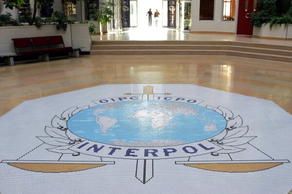 FILE - The entrance hall of Interpol's headquarters in Lyon, central France on Sept. 27, 2017. (AP Photo/Laurent Cipriani, File)