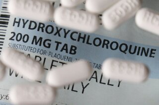 FILE - This Monday, April 6, 2020 file photo shows an arrangement of hydroxychloroquine tablets in Las Vegas. According to results released on Thursday, May 7, 2020, a new study finds no evidence of benefit from a malaria drug widely promoted as a treatment for coronavirus infection. Hydroxychloroquine did not lower the risk of dying or needing a breathing tube in a comparison that involved nearly 1,400 consecutive patients treated at Columbia University Irving Medical Center in New York. (AP Photo/John Locher)
