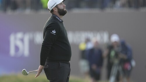 Spain's Jon Rahm waits to putt on the 18th green on the first day of the British Open Golf Championships at the Royal Liverpool Golf Club in Hoylake, England, Thursday, July 20, 2023. (AP Photo/Kin Cheung)