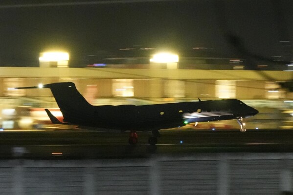 A plane carrying former President Rodrigo Duterte to The Hague takes off in Manila, Philippines on Tuesday, March 11, 2025. (AP Photo/Aaron Favila)