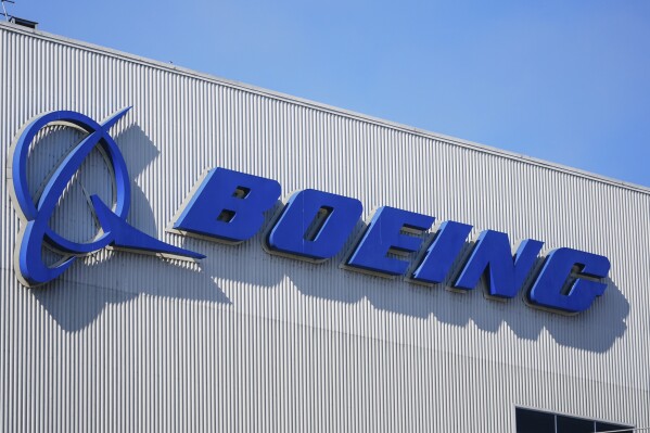 The Boeing logo is displayed at the company's factory, Sept. 24, 2024, in Renton, Wash. (AP Photo/Lindsey Wasson, File)