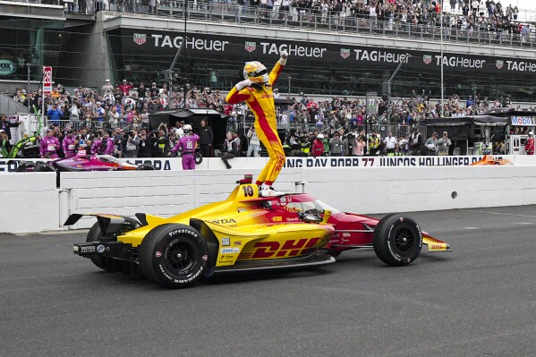 Alex Palou, of Spain, celebrates after winning the Indianapolis 500 auto race at Indianapolis Motor Speedway in Indianapolis, Sunday, May 25, 2025. (AP Photo/AJ Mast)