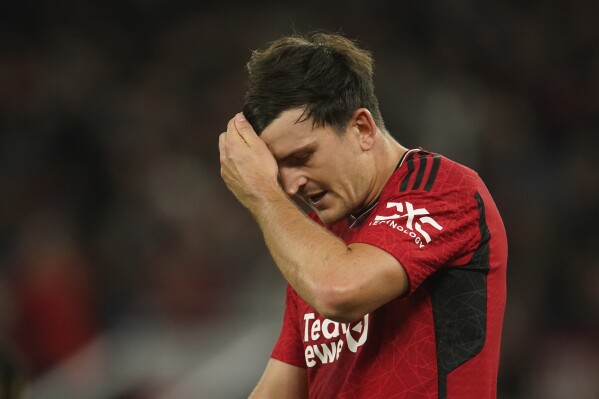 Manchester United's Harry Maguire gestures during the English League Cup third round soccer match between Manchester United and Crystal Palace at Old Trafford stadium in Manchester, England, Tuesday, Sept. 26, 2023. (AP Photo/Dave Thompson)