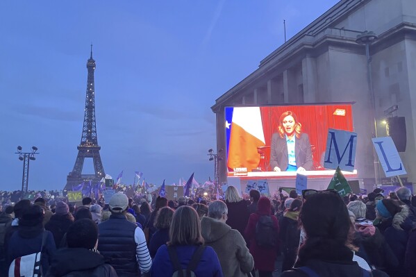 Pro-abortion supporters watch a live transmission of the congress session where French lawmakers have approved a bill that will enshrine a woman’s right to an abortion in the French Constitution, at Trocadero Plaza in Paris, Monday, March 4, 2024. The vote makes France the first country to have a constitutional right to abortion since the former Yugoslavia inscribed it in its 1974 constitution. (AP Photo/Oleg Cetinic)