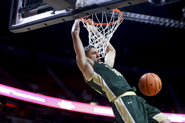 Colorado State guard Nique Clifford dunk against Nevada during the first half of an NCAA college basketball game in the quarterfinals of the Mountain West tournament Thursday, March 14, 2024, in Las Vegas. (AP Photo/Ian Maule)