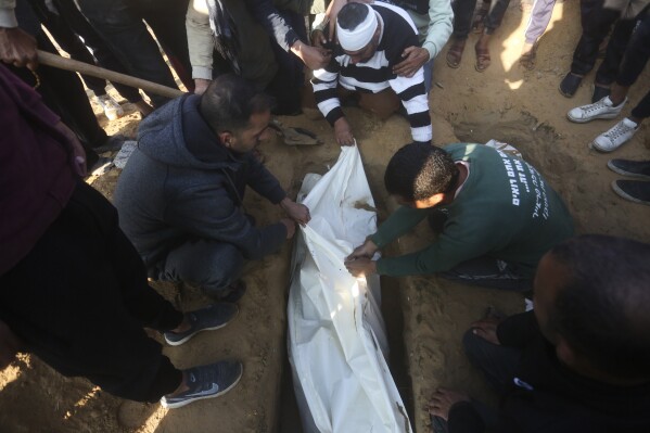Palestinians bury a four-year-old Abdul Rahman Muamm, killed in the Israeli bombardment of the Gaza Strip, during his funeral in Khan Younis, Monday, Feb. 26, 2024. (AP Photo/Hatem Ali)