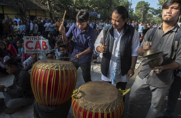Indian students beat traditional drums as they join fellow students in a protest against the Citizenship Amendment Bill (CAB) in Gauhati, India, Friday, Dec. 6, 2019. More than 1,000 students marched Friday in India’s northeast against a bill approved by Prime Minister Narendra Modi’s government to grant citizenship to non-Muslim migrants from India's three Muslim-majority neighbors. (AP Photo/Anupam Nath)