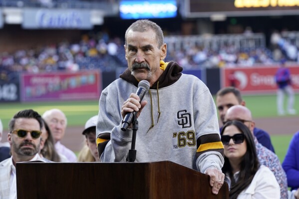 FILE - San Diego Padres owner Peter Seidler speaks during induction ceremonies for the Padres Hall of Fame before a baseball game against the Texas Rangers, Friday, July 28, 2023, in San Diego. Seidler, who spent hundreds of millions of dollars trying to bring a long-elusive World Series championship to San Diego, died on Tuesday, the team announced. He was 63. (AP Photo/Gregory Bull, File)
