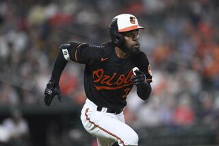 Baltimore Orioles' Cedric Mullins races to third on a triple against the Pittsburgh Pirates during the fifth inning of a baseball game Friday, May 12, 2023, in Baltimore. (AP Photo/Gail Burton)