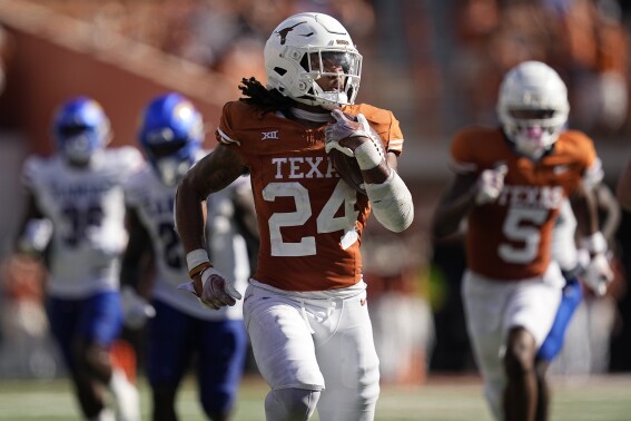 Texas running back Jonathon Brooks (24) breaks away for a touchdown run against Kansas during the second half of an NCAA college football game in Austin, Texas, Saturday, Sept. 30, 2023. (AP Photo/Eric Gay)