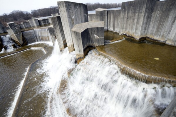 Water flows at the Stepping Stone Falls, Monday, March 25, 2024, in Flint, Mich. (AP Photo/Carlos Osorio)