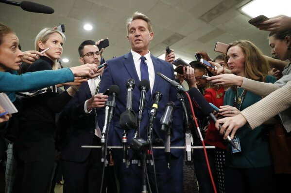 
              Sen. Jeff Flake, R-Ariz., speaks to members of the media after leaving a closed door meeting about Saudi Arabia with Secretary of State Mike Pompeo, Wednesday, Nov. 28, 2018, on Capitol Hill in Washington. (AP Photo/Pablo Martinez Monsivais)
            