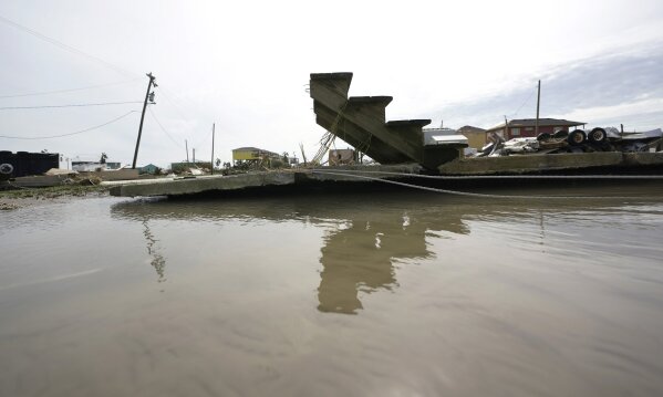 Stair steps and a slab are left behind in the wake of Hurricane Laura, Thursday, Aug. 27, 2020, in Holly Beach, La. (AP Photo/Eric Gay)