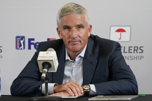 FILE - PGA Tour Commissioner Jay Monahan speaks during a news conference before the Travelers Championship golf tournament at TPC River Highlands, June 22, 2022, in Cromwell, Conn. The PGA Tour is getting a $3 billion investment from Strategic Sports Group in a deal that would give players access to more than $1.5 billion as equity owners in the new PGA Tour Enterprises. The Associated Press obtained a copy of the announcement expected to be released Wednesday morning, Jan. 31, 2024. Monahan was holding a conference call with players about the deal that was finalized Tuesday night. (AP Photo/Seth Wenig, File)