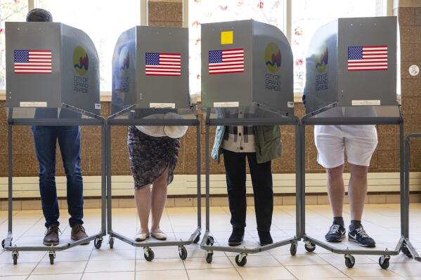 People cast their ballots at Coit Arts Academy in Grand Rapids on Tuesday, Nov. 8, 2022. (Joel Bissell/The Grand Rapids Press via AP)
