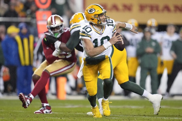 Green Bay Packers quarterback Jordan Love (10) rolls out of the pocket during the second half of an NFL football NFC divisional playoff game against the San Francisco 49ers, Saturday, Jan. 20, 2024, in Santa Clara, Calif. (AP Photo/Ashley Landis)