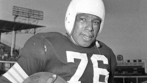 FILE - Cleveland Browns NFL football player Marion Motley is shown Dec. 5, 1948, in Cleveland. The Cleveland Browns will shelve those classic logo-less orange helmets for three games this season. With a nod to the team's storied past, the Browns will wear white helmets for the first time since 1951. (AP Photo/Harry Hall, File)