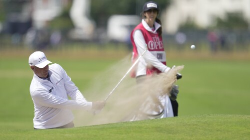 United States Stewart Cink plays out of a bunker on the 18th green on the first day of the British Open Golf Championships at the Royal Liverpool Golf Club in Hoylake, England, Thursday, July 20, 2023. (AP Photo/Kin Cheung)
