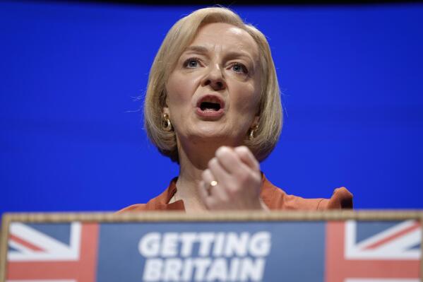FILE - Britain's Prime Minister Liz Truss makes a speech at the Conservative Party conference at the ICC in Birmingham, England, Oct. 5, 2022. After an acrimonious divorce and years of bickering, Britain’s government looks like it wants to make up with the European Union. On Thursday, Oct. 6 Truss travels to the Czech Republic to attend the first meeting of the European Political Community, an initiative of French President Emmanuel Macron that brings together EU members and countries outside the union. (AP Photo/Kirsty Wigglesworth, file)