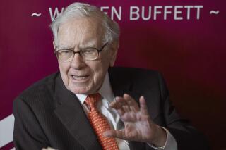 FILE - Warren Buffett, Chairman and CEO of Berkshire Hathaway, speaks during a game of bridge following the annual Berkshire Hathaway shareholders meeting on May 5, 2019, in Omaha, Neb. Buffett assured investors Wednesday, April 12, 2023, that Berkshire Hathaway will be fine when he's no longer around to lead the conglomerate because Vice Chairman Greg Abel will do a great job and the conglomerate's basic model won't change. (AP Photo/Nati Harnik, File)