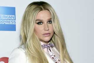 FILE - Kesha attends the 11th annual Billboard Women in Music honors at Pier 36 on Friday, Dec. 9, 2016, in New York. Billboard Women in Music 2016 will air Dec. 12 on Lifetime. Pop star Kesha and producer Dr. Luke have settled nearly a decade of suits and countersuits over her accusation that he drugged and raped her and his claim that she made it up and defamed him, they announced Thursday, June 22, 2023, with the singer saying that “only God knows what happened that night.” (Photo by Evan Agostini/Invision/AP, File)