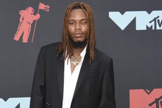 FILE - Fetty Wap appears at the MTV Video Music Awards in Newark, N.J. on Aug. 26, 2019. Fetty Wap, whose real name is Willie Maxwell, has been jailed after prosecutors say he threatened to kill a man during a FaceTime call in 2021, violating the terms of his pretrial release in a pending federal drug conspiracy case. U.S. Magistrate Judge Steven Locke, acting on a request from prosecutors, revoked Maxwell’s bond and sent him to jail following a hearing in federal court on Long Island. (Photo by Evan Agostini/Invision/AP, File)