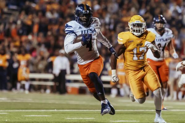 THIS CORRECTS THE IDENTICATION OF THE UTSA PLAYER TO ZAKHARI FRANKLIN AND NOT ANTONIO PARKS AS ORIGINALLY SENT - UTSA's Zakhari Franklin (4) runs for yardage against UTEP during an NCAA college football game in El Paso, Texas, Saturday, Nov. 6, 2021. (Gaby Velasquez/The El Paso Times via AP)