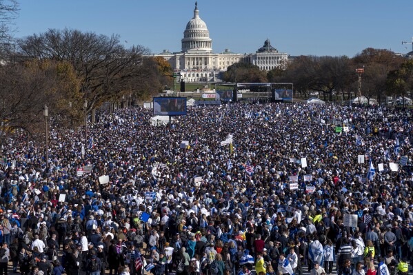 People attend the March for Israel rally Tuesday, Nov. 14, 2023, on the National Mall in Washington. As the Israel-Hamas war rages in Gaza, there's a bitter battle for public opinion flaring in the U.S., with angry rallies and disruptive protests at prominent venues in several major cities. Among the catalysts are Palestinian and Jewish-led groups that have been active for years in opposing Israeli policies toward the Palestinians. Now many groups involved in those earlier efforts are playing a key role protesting the latest fighting, with actions on campuses and beyond. (AP Photo/Jacquelyn Martin)
