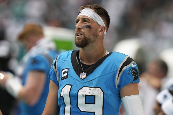 Carolina Panthers wide receiver Adam Thielen (19) watches from the sidelines during the second half of an NFL football game against the Miami Dolphins, Sunday, Oct. 15, 2023, in Miami Gardens, Fla. The Dolphins defeated the Panthers 42- 21. (AP Photo/Lynne Sladky)