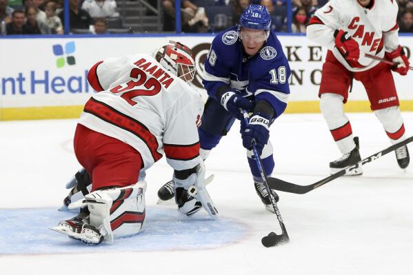 Carolina Hurricanes goaltender Antti Raanta makes a save against Tampa Bay Lightning's Ondrej Palat during the second period of a preseason NHL hockey game Friday, Oct. 1, 2021, in Tampa, Fla. (AP Photo/Mike Carlson)