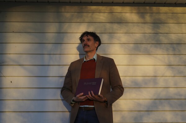 Nathan Rees, a committee member and Sacred Harp museum curator, poses for a portrait outside of The Sacred Harp Publishing Company and Museum in Carrolton, Ga., on Friday, March 21, 2025. (AP Photo/Jessie Wardarski)