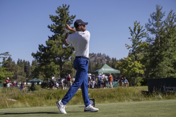 Stephen Curry watches a tee shot Friday, July 14, 2023, during the first round of the American Century Championship celebrity golf tournament at Edgewood Tahoe Golf Course in Stateline, Nev. (Hector Amezcua/The Sacramento Bee via AP)