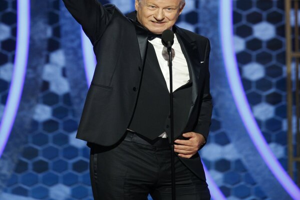 This image released by NBC shows Stellan Skarsgård accepting the award for best supporting actor in a TV series, limited series or TV movie for "Chernobyl" at the 77th Annual Golden Globe Awards at the Beverly Hilton Hotel in Beverly Hills, Calif., on Sunday, Jan. 5, 2020. (Paul Drinkwater/NBC via AP)