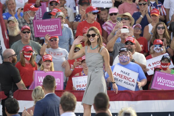 Counselor to the President Hope Hicks waves to the crowd after President Donald Trump asked her to come to the stage during a campaign rally at the Ocala International Airport, Friday, Oct. 16, 2020, in Ocala, Fla. (AP Photo/Phelan M. Ebenhack)