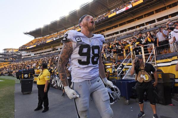 Las Vegas Raiders defensive end Maxx Crosby (98) celebrates as he heads to the locker room following an NFL football game against the Pittsburgh Steelers in Pittsburgh, Sunday, Sept. 19, 2021. (AP Photo/Don Wright)