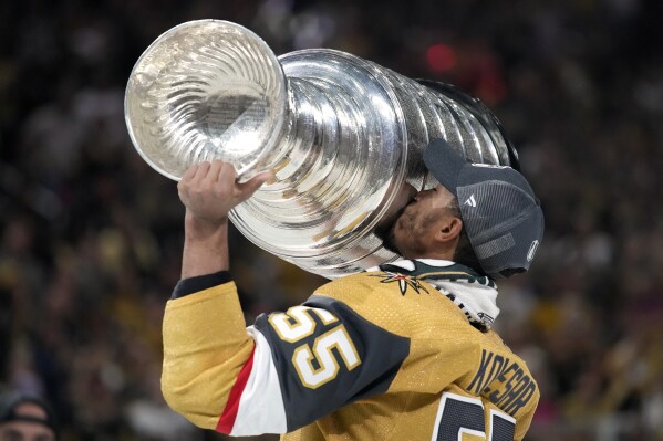 Vegas Golden Knights right wing Keegan Kolesar kisses the Stanley Cup after the Knights defeated the Florida Panthers 9-3 in Game 5 of the NHL hockey Stanley Cup Finals Tuesday, June 13, 2023, in Las Vegas. The Knights won the series 4-1. (AP Photo/John Locher)