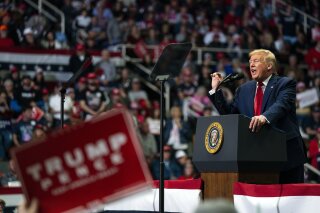 FILE - In this March 2, 2020, file photo President Donald Trump speaks during a campaign rally at Bojangles Coliseum in Charlotte, N.C. Trump's record-setting fundraising pace slowed slightly amid the coronavirus outbreak, but remained strong as he remains on track to top Democrats. (AP Photo/Evan Vucci, File)