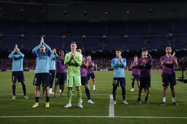 Barcelona players applaud fans at the end of the Champions League Group C soccer match between Barcelona and Bayern Munich at the Camp Nou stadium in Barcelona, Spain, Wednesday, Oct. 26, 2022. (AP Photo/Joan Monfort)