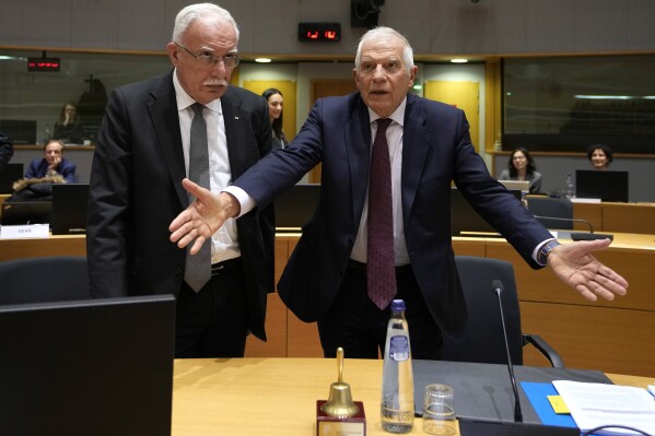 Palestinian Foreign Minister Riyad Najeeb al-Maliki, left, speaks with European Union foreign policy chief Josep Borrell during a meeting of EU foreign ministers at the European Council building in Brussels, Monday, Jan. 22, 2024. European Union Foreign Affairs Ministers meet in Brussels on Monday to discuss the situation in the Middle East and in Ukraine. (AP Photo/Virginia Mayo, Pool)