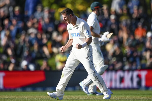 New Zealand's Matt Henry celebrates after taking the wicket of Australia's Cam Green on day one for the second cricket test between New Zealand and Australia in Christchurch, New Zealand, Friday March 8, 2024. (John Davidson/Photosport via AP)
