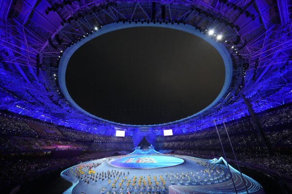 Artist perform ahead of the opening ceremony of the 19th Asian Games in Hangzhou, China, Saturday, Sept. 23, 2023. (AP Photo/Eugene Hoshiko)