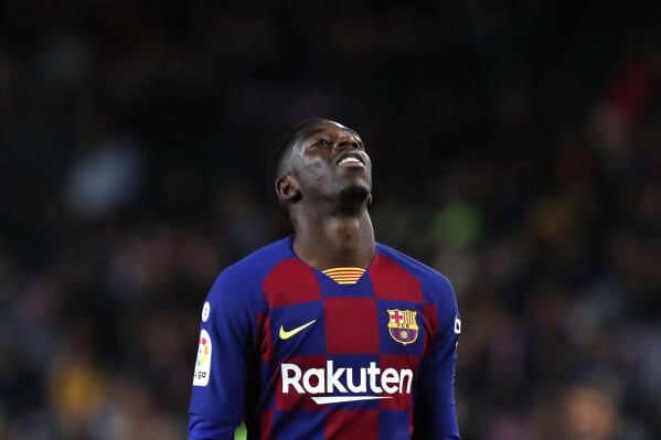 FILE - In this Nov. 9, 2019 file photo, Barcelona's Ousmane Dembele reacts during Spanish La Liga soccer match between Barcelona and Celta at the Camp Nou stadium in Barcelona. More than 17,000 fans were at the Camp Nou when Ousmane Dembele was officially introduced by Barcelona in 2017. The expectations were high at the time. Two and a half seasons later, though, Barcelona fans are still waiting for Dembele to meet all those expectations that came along with his signing. (AP Photo/Joan Monfort, File)