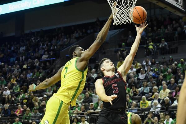 Oregon center N'Faly Dante (1) blocks the shot of Stanford guard Michael O'Connell (5) during the second half of an NCAA college basketball game Saturday, March 4, 2023, in Eugene, Ore. (AP Photo/Andy Nelson)