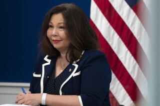 FILE - Sen. Tammy Duckworth, D-Ill., attends a discussion of care policies with Vice President Kamala Harris, on Oct. 14, 2021, in the South Court Auditorium on the White House complex in Washington. Women — and some men — in Congress have been fighting for government child care assistance for almost 80 years. With President Joe Biden's $1.85 trillion social services package, they are as close as they have ever been to winning. "I think COVID really illustrated to people how broken our child care system is in a way that people finally understood," said Duckworth. (AP Photo/Jacquelyn Martin, File)