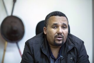 FILE - In this Thursday Oct. 24, 2019 file photo, Jawar Mohammed speaks during an interview with The Associated Press at his house in Addis Ababa, Ethiopia. Ethiopia's most prominent opposition fig...
